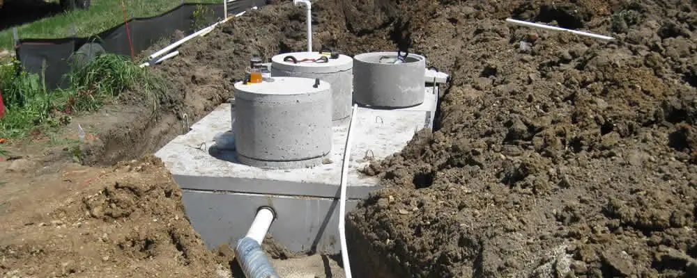 Septic system repair and installation site with tank access ports in Evansville, IN