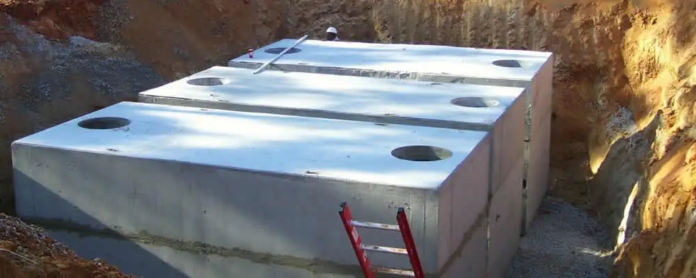 Septic tank installation site with a newly placed concrete tank in Evansville, IN